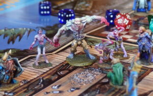 Les aventuriers aux prises avec un golem de chair et des zombies